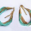 Bracelet multi-fils en perle de rocaille et chaine de métal doré