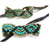 Bracelet perles turquoises et dorées sur  macramé coton marron