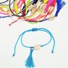 Bracelets CAURI POMPON