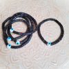 Bracelet perles Heishi noires et oeil bleu