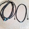 Collier perles Heishi noires et oeil bleu