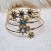 Bracelet de bras soleil en métal doré et pierres