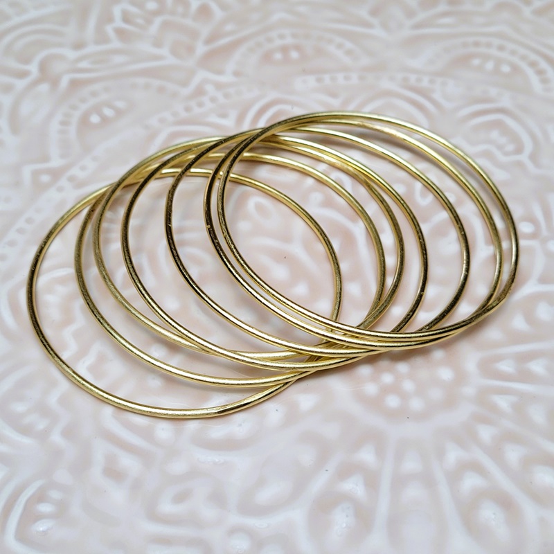 Sept Joncs ou semainier rigide doré Melissa Sept Joncs ou semainier rigide doré Melissa